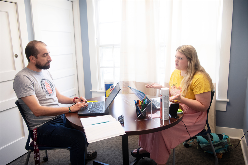 Consultant Discusses Work with Graduate Student